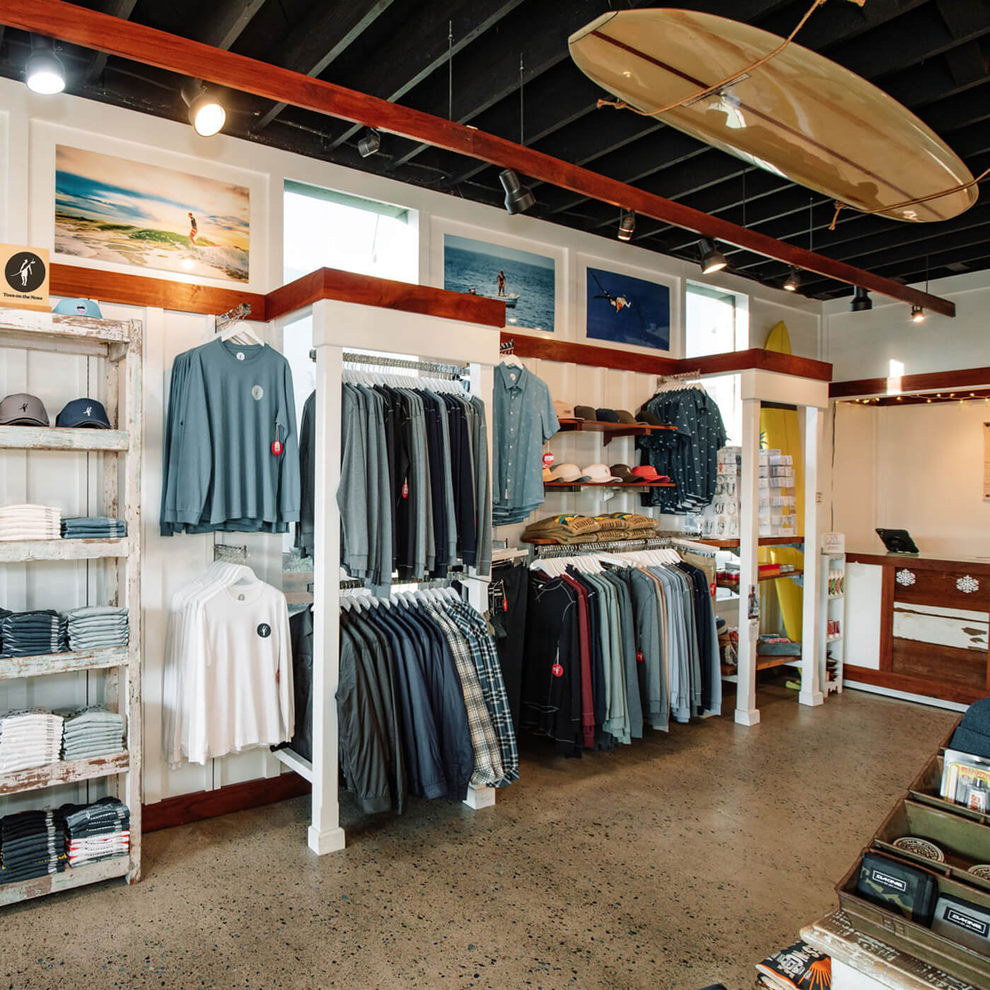 Men’s coastal apparel and surf-inspired clothing display at Toes on the Nose Laguna Beach location