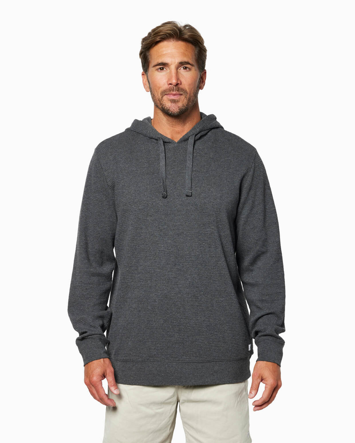 Man wearing a heather smoke hoodie on a white background #color_heather smoke