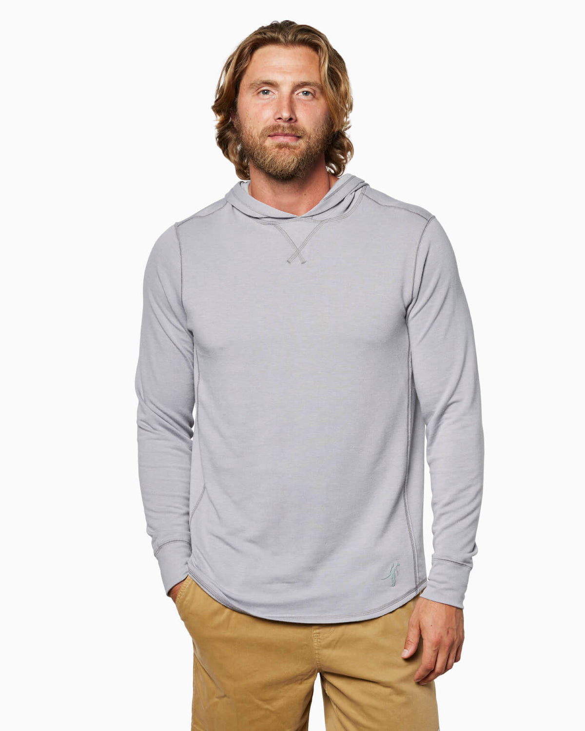 Man wearing a gray hoodie and beige pants on a white background
 #color_light grey