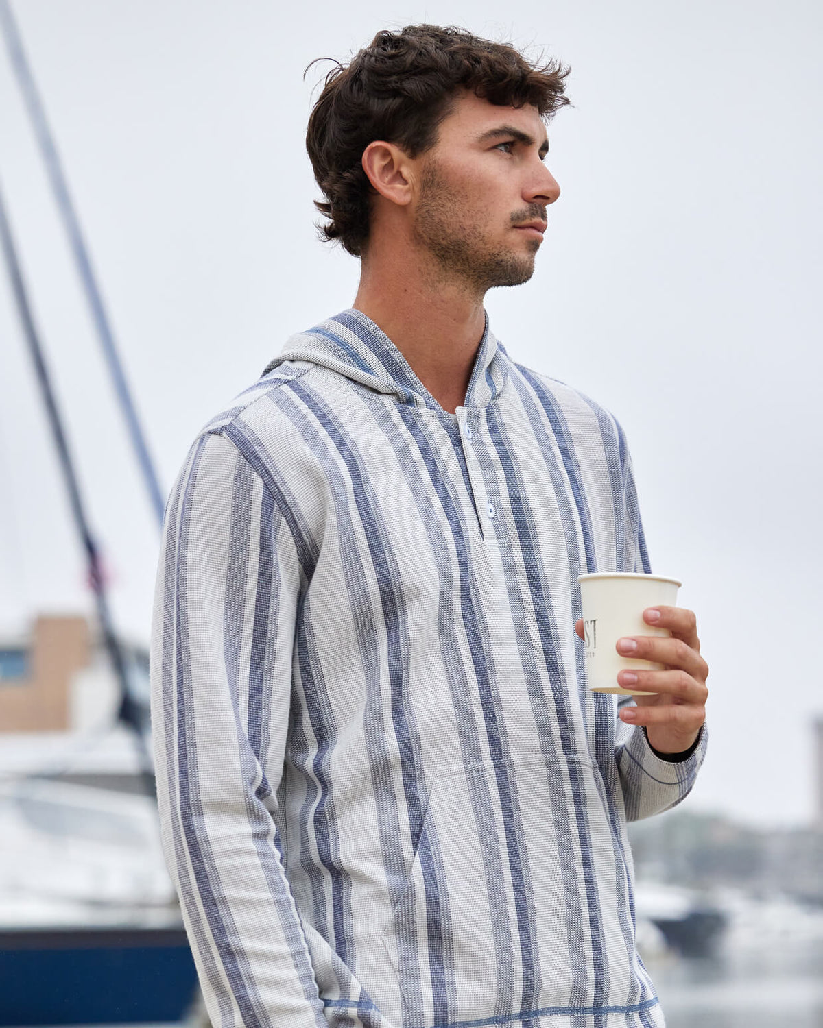 Men's natural stripe hoodie from Toes on the Nose, worn in a lifestyle setting outdoors. #color_natural stripe