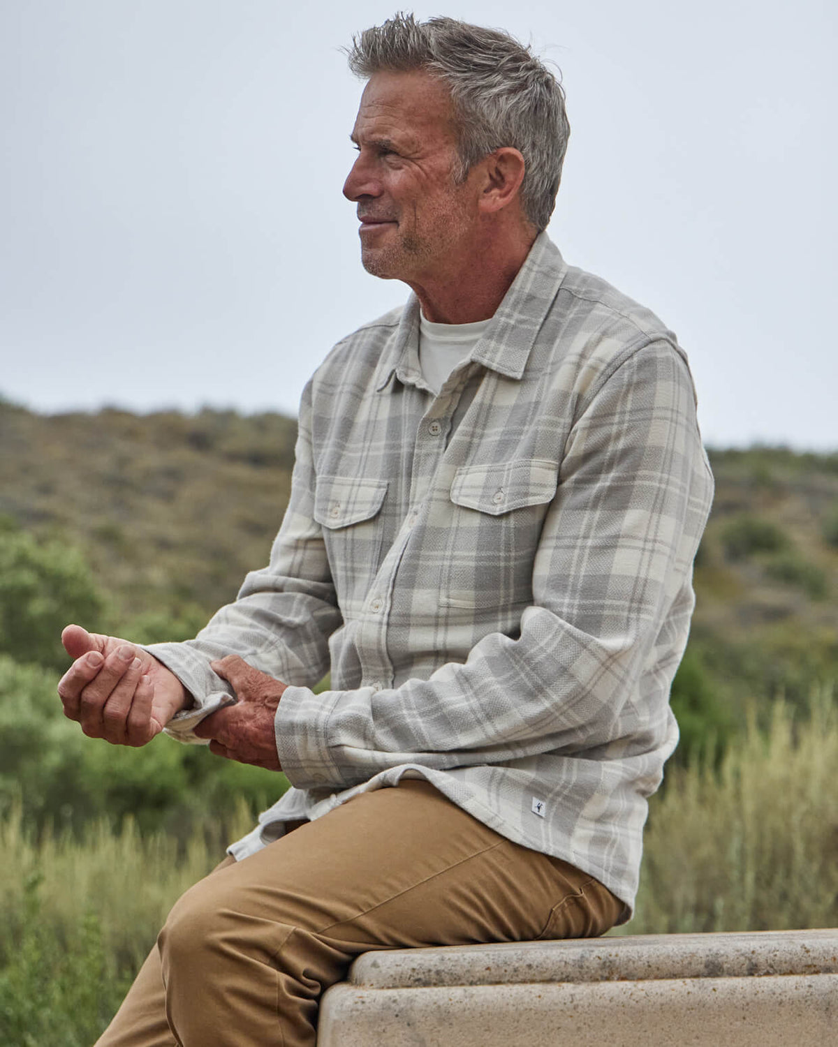 Men's vintage white flannel from Toes on the Nose, worn in a lifestyle setting outdoors. #color_vintage oak white