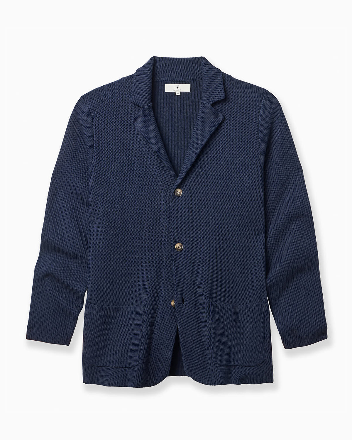 A navy blue textured knit cardigan sweater with notch lapels, three buttons, and front patch pockets, displayed on a clean white background. #color_eastate navy