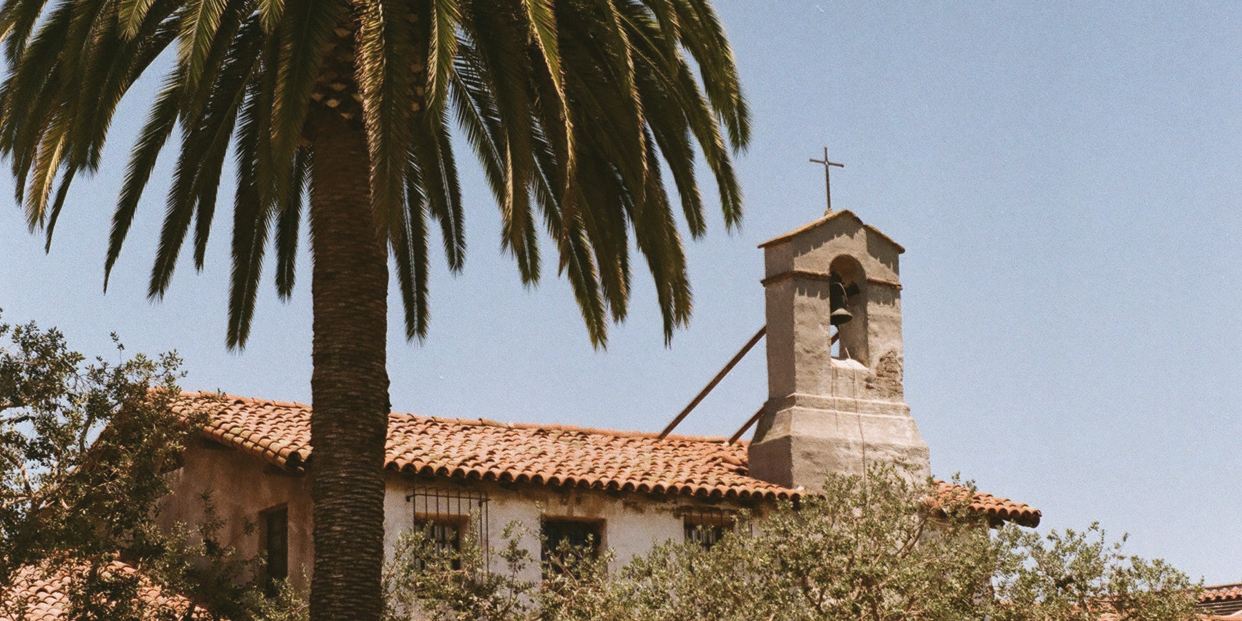Toes on the Nose San Juan Capistrano storefront with palm trees and historic Spanish-style architecture