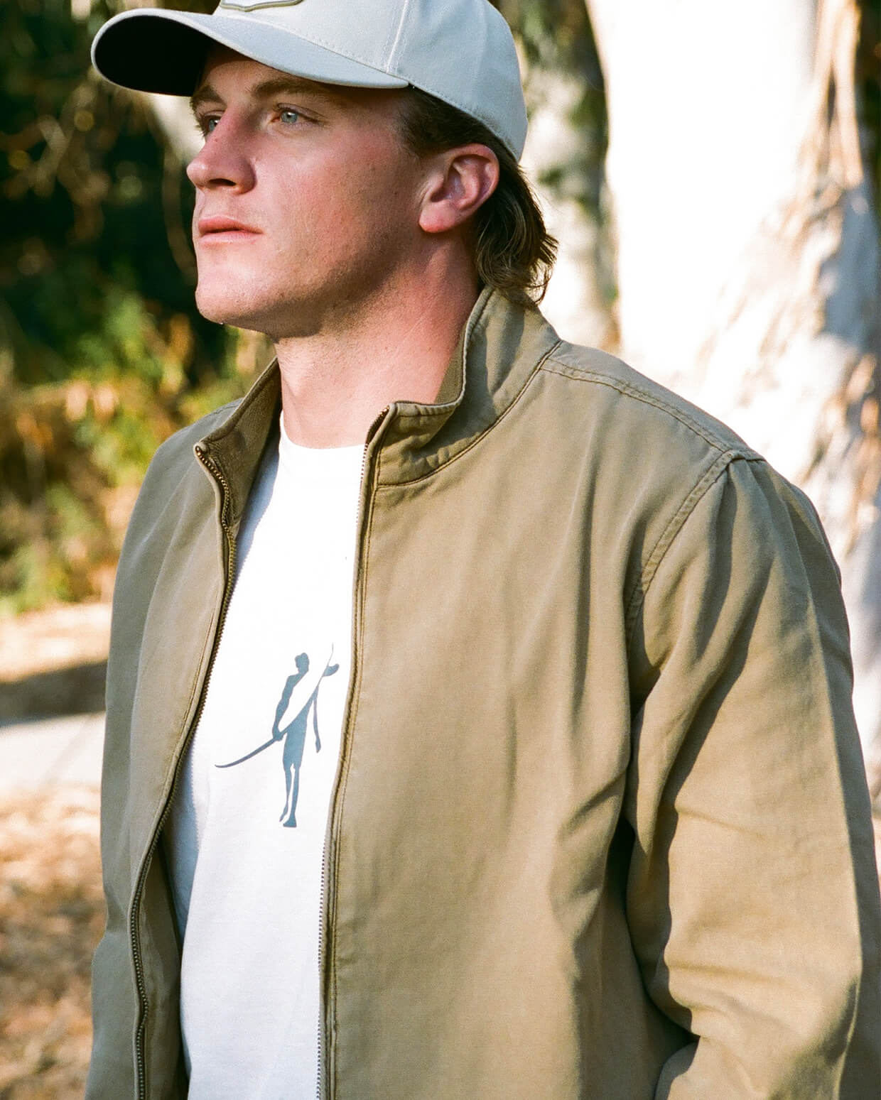 Men's light beige t-shirt with Toes on the Nose logo, angled on a clean background.