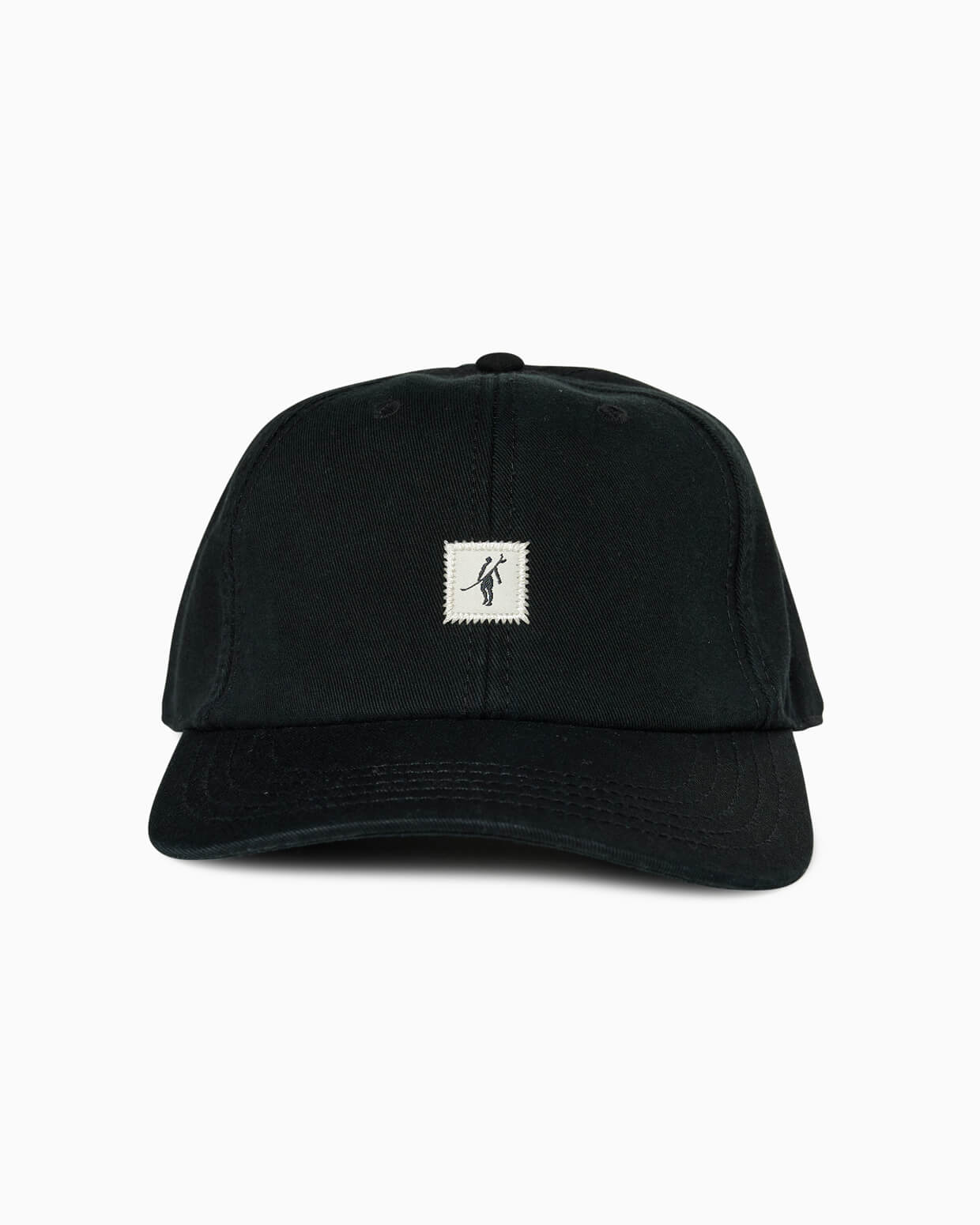 Black baseball cap with small square Toes on the Nose surfer patch, front studio view.