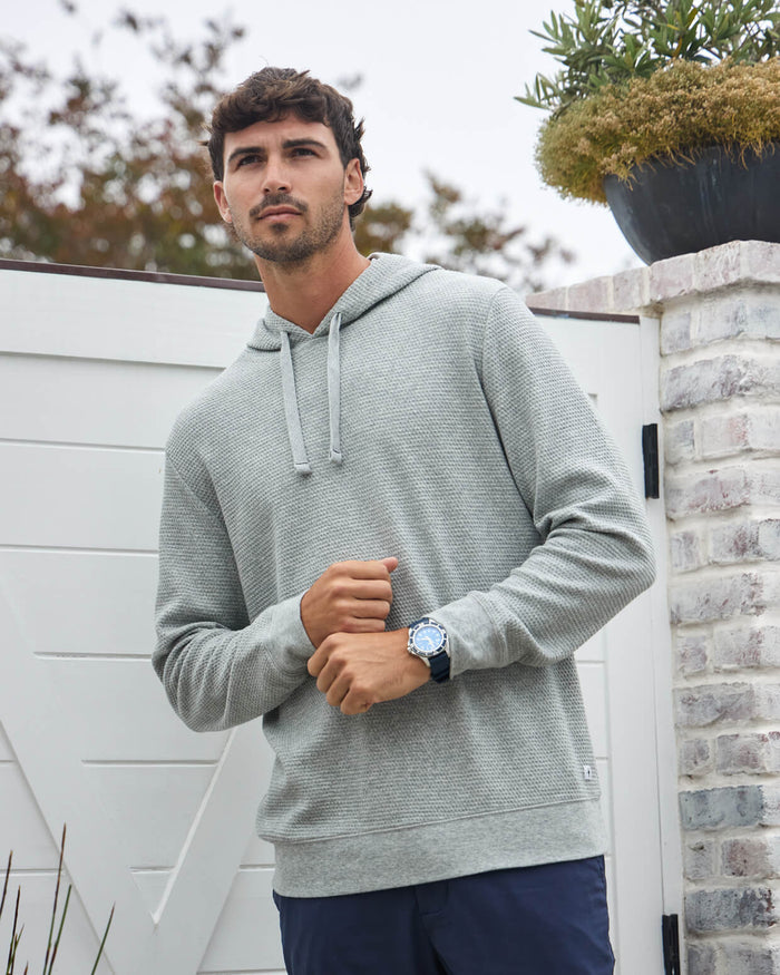 Premium hoodie styled with tailored trousers for a polished look