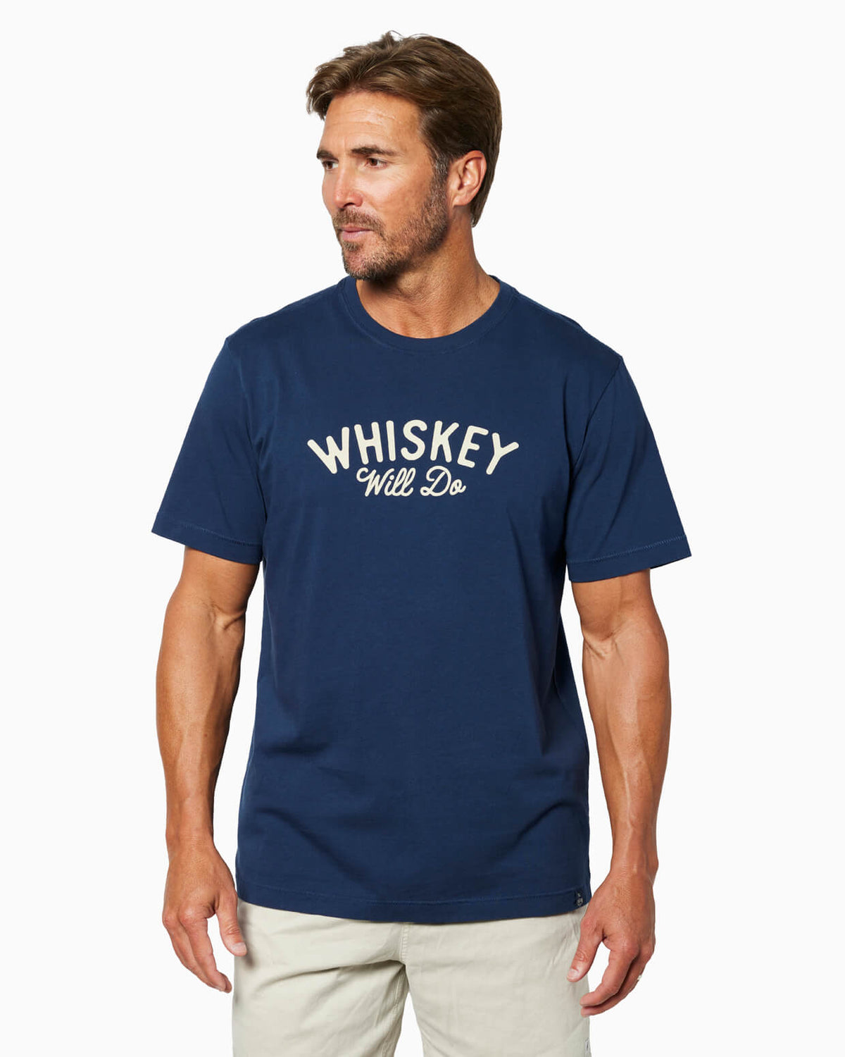 Man wearing a navy blue t-shirt with 'WHISKEY WILL DO' text on a white background #color_navy