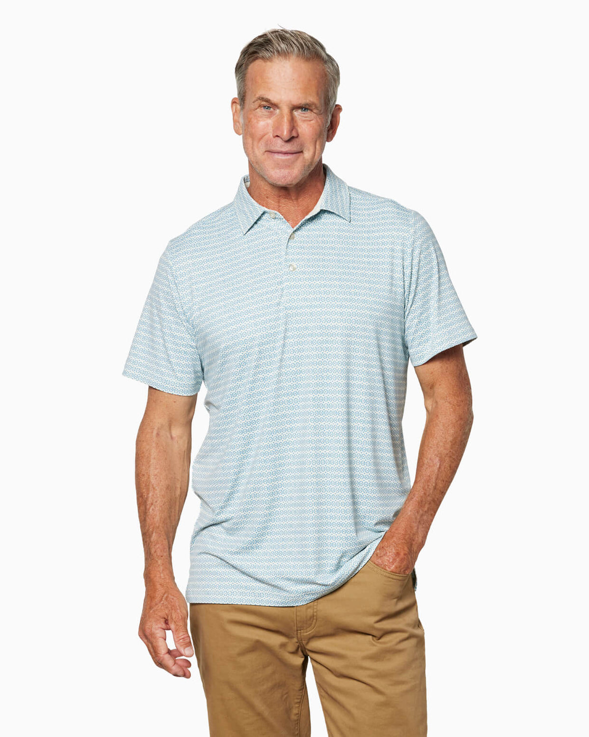 Man wearing a light blue patterned polo shirt and pants on a white background  #color_sea geo