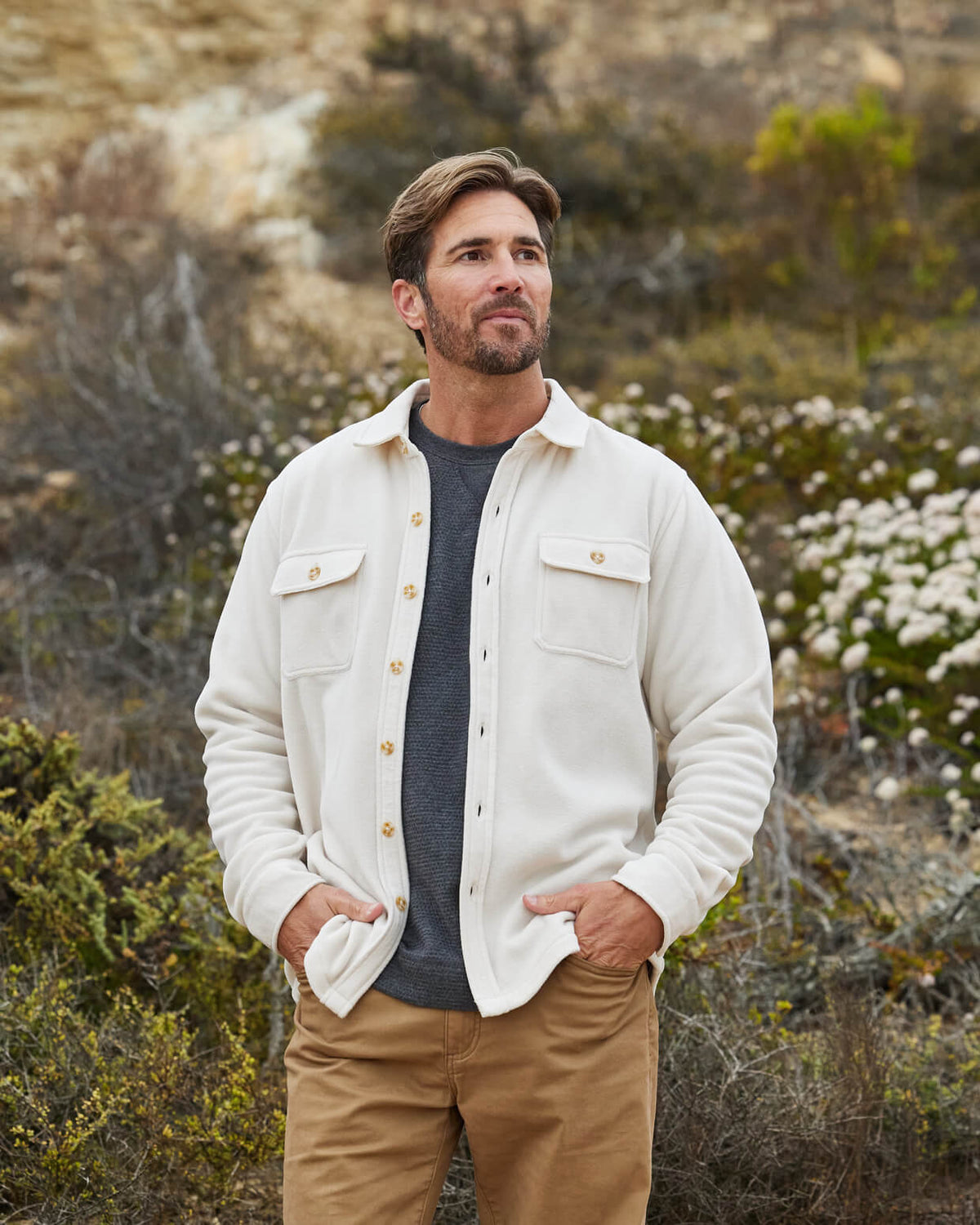 Man in vintage white button up from Toes on the Nose, worn in a lifestyle setting outdoors. #color_vintage white