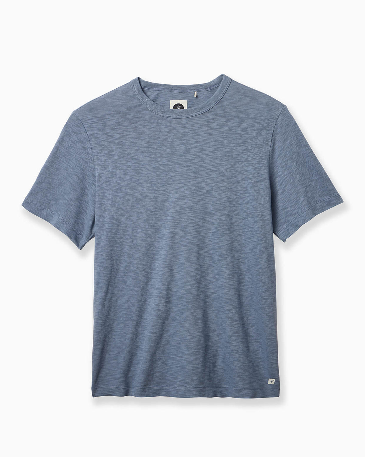 A short-sleeve crewneck t-shirt in a heathered slate blue color, shown flat against a light off-white background. #color_blue flint slub