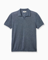 A short-sleeve knit polo shirt in a heathered slate blue color, presented flat against a clean white background. #color_journal blue
