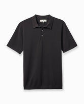 A black short-sleeve polo shirt with a three-button placket, displayed flat against a clean white background. #color_garrett charcoal