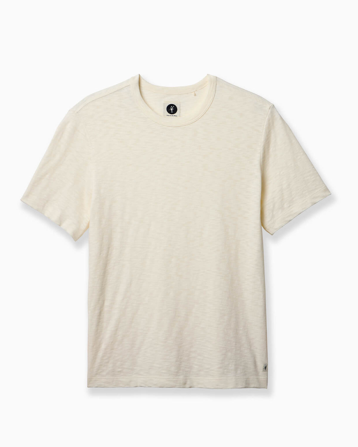 A short-sleeve crewneck t-shirt in a light cream or off-white heathered fabric, shown flat against a clean white background. #color_natural slub