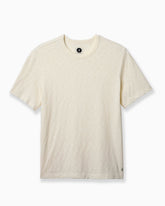 A short-sleeve crewneck t-shirt in a light cream or off-white heathered fabric, shown flat against a clean white background. #color_natural slub