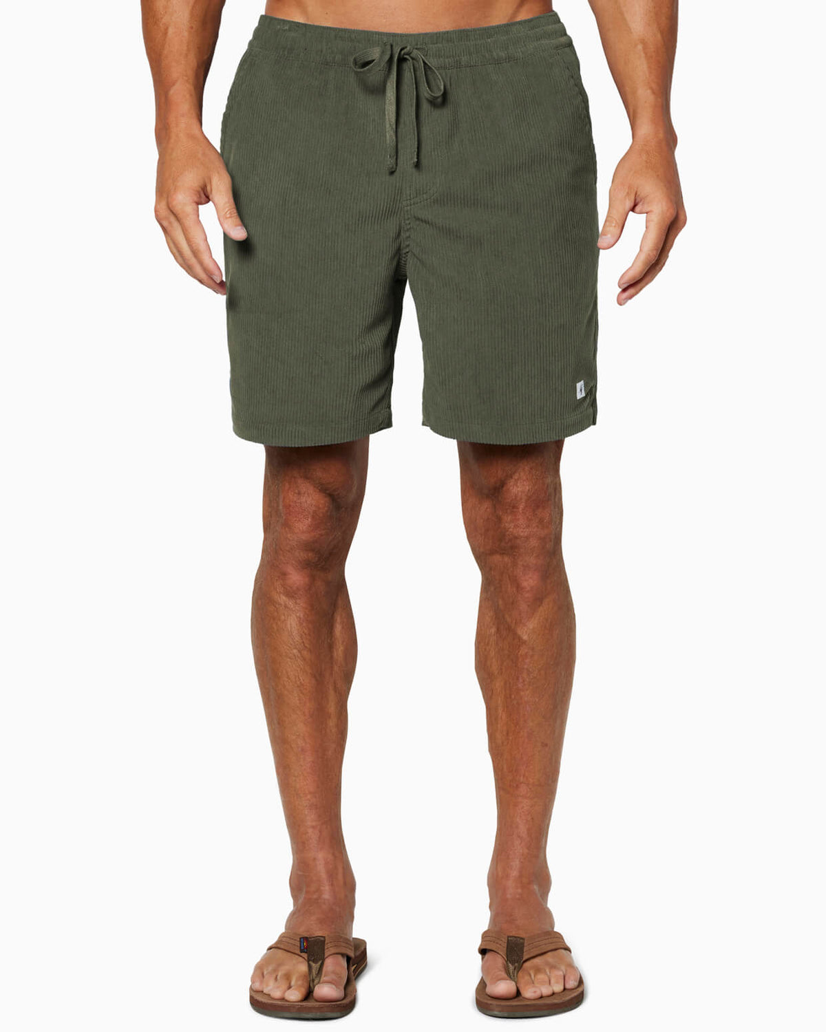 Person wearing green shorts on a white background #color_olive cord