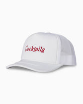 White mesh-back trucker hat with red “Cocktails” embroidery, front-angled studio shot.