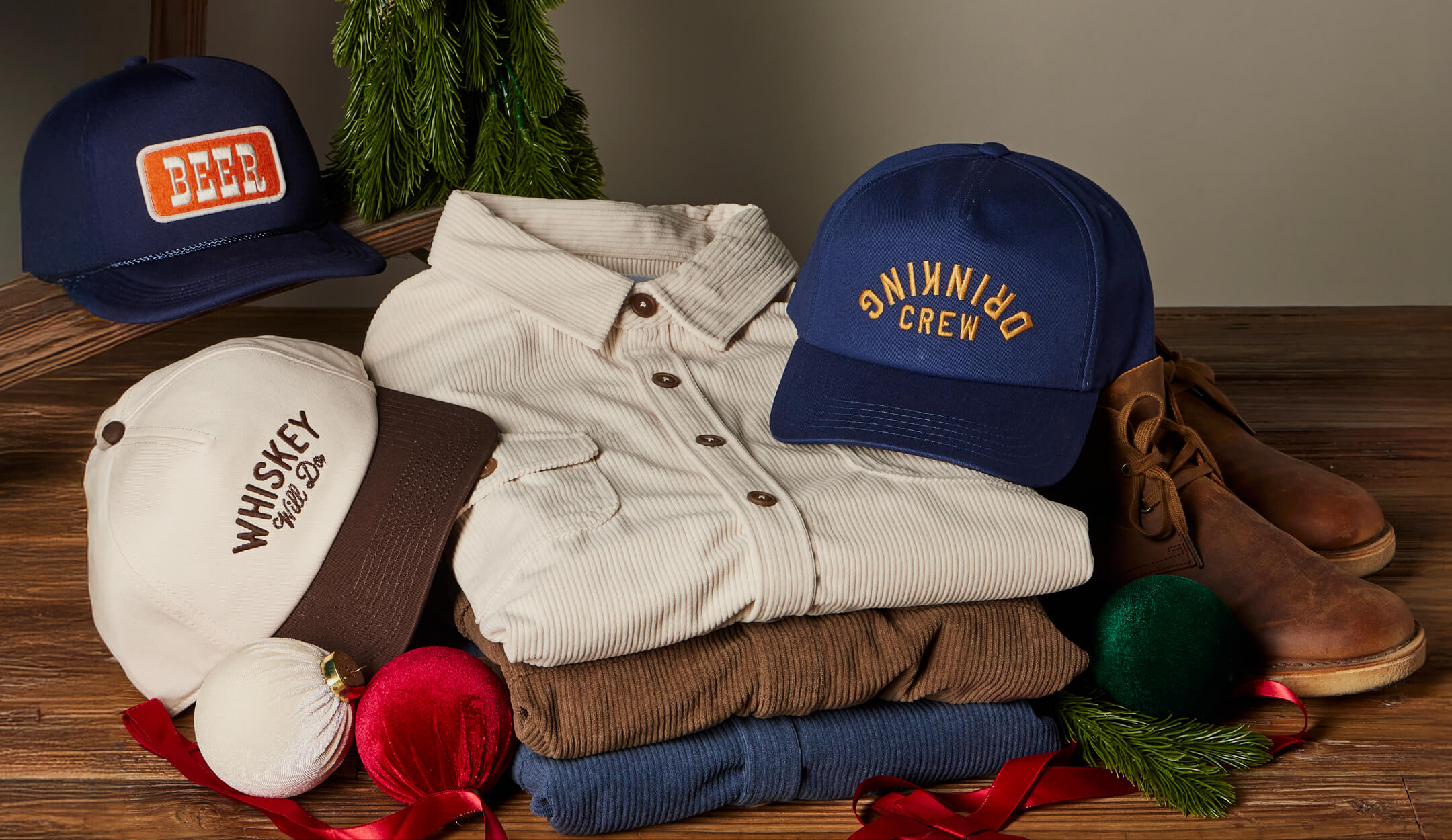 Toes on the Nose Gift Guide showasing long sleeve button ups and hat on desktop view