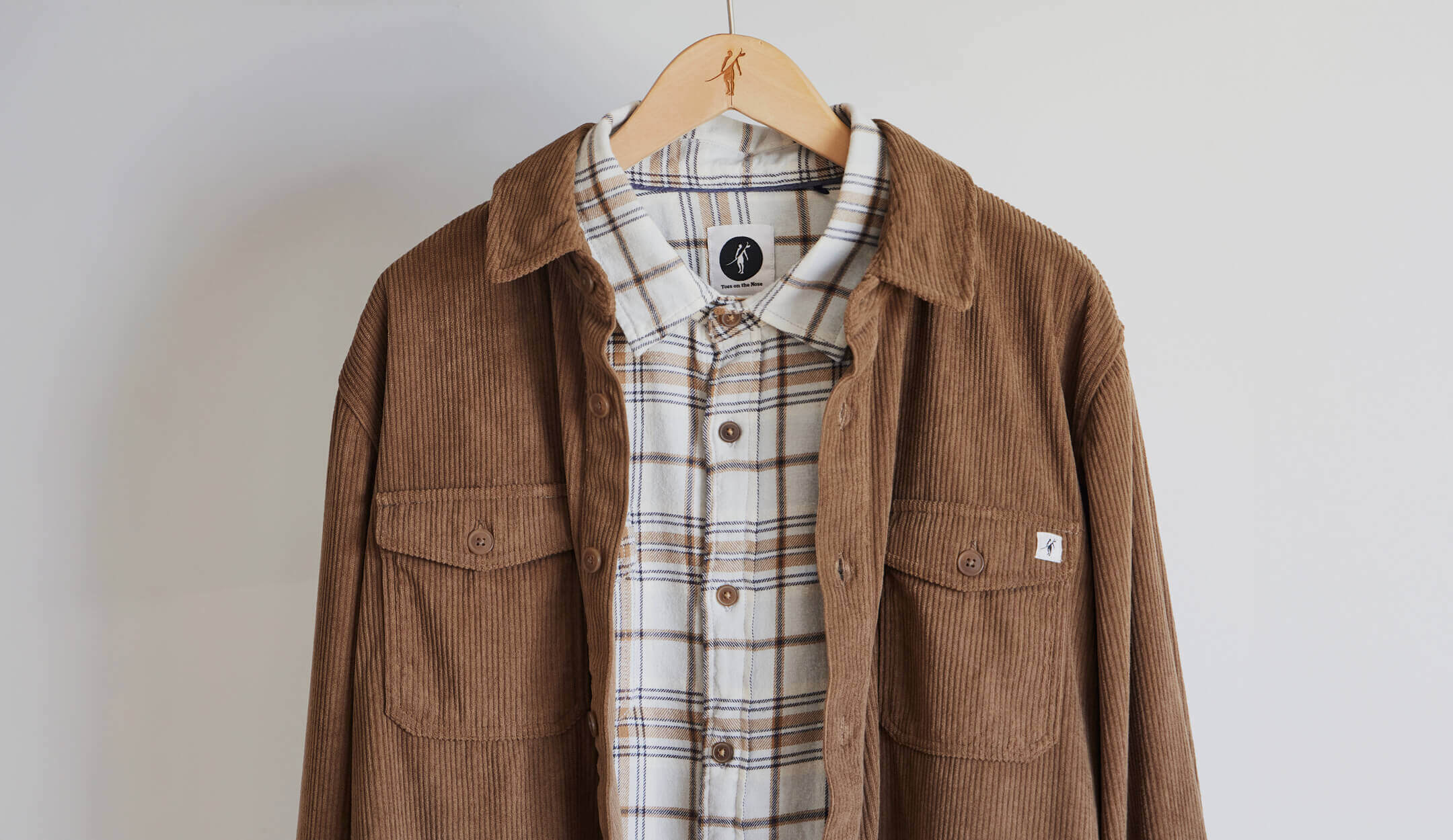 Toes on the Nose sunridge corduroy shirt layered over a fall flannel on desktop view