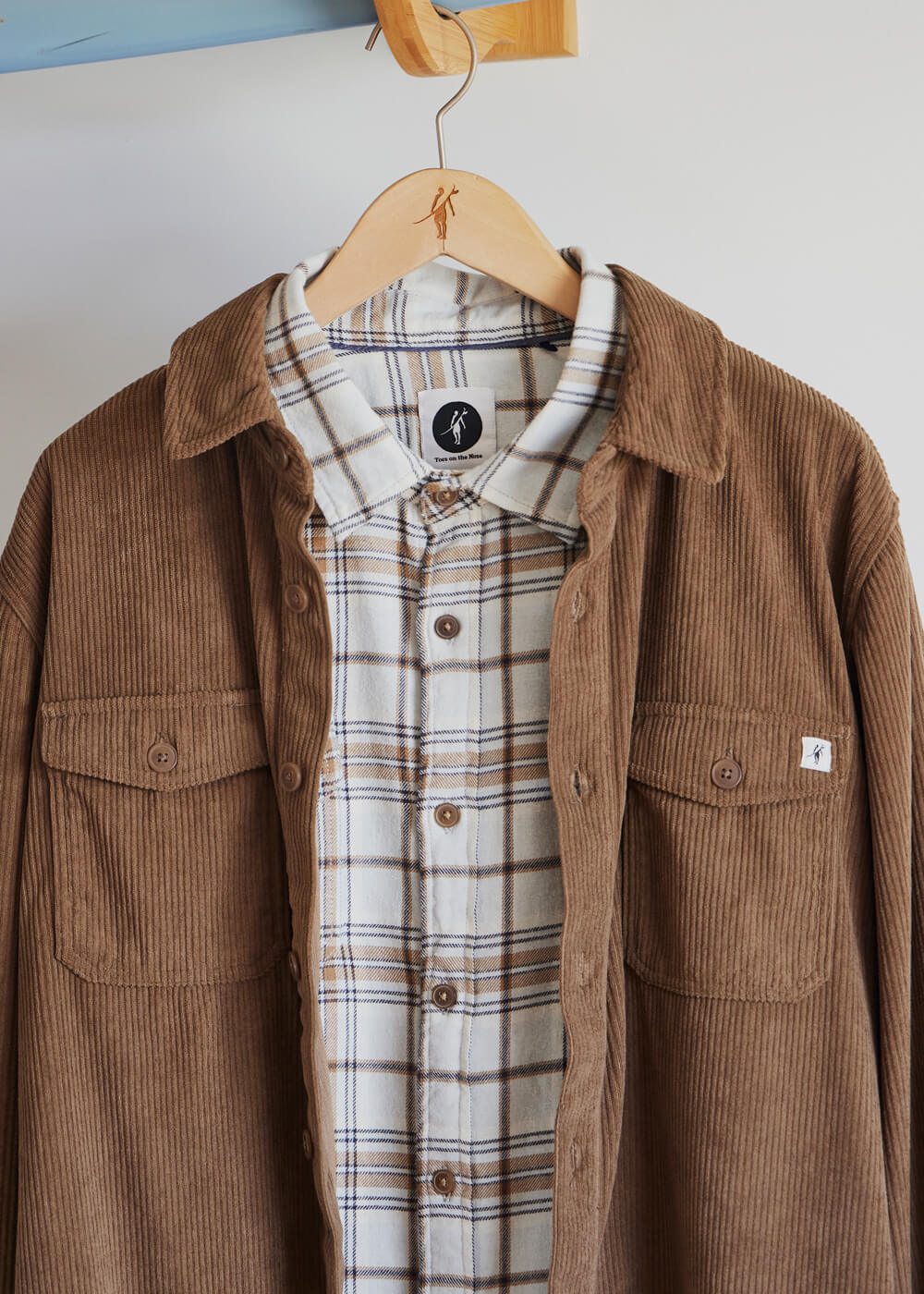 Toes on the Nose sunridge corduroy shirt layered over a fall flannel on mobile view