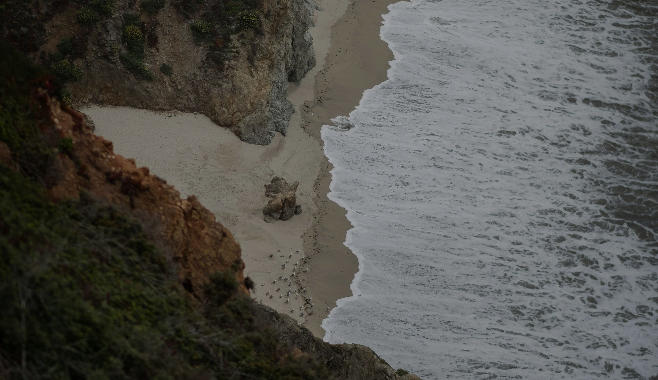 Toes on the Nose all Clearance Sale image of rocky coastline offering up to 70% off on desktop view
